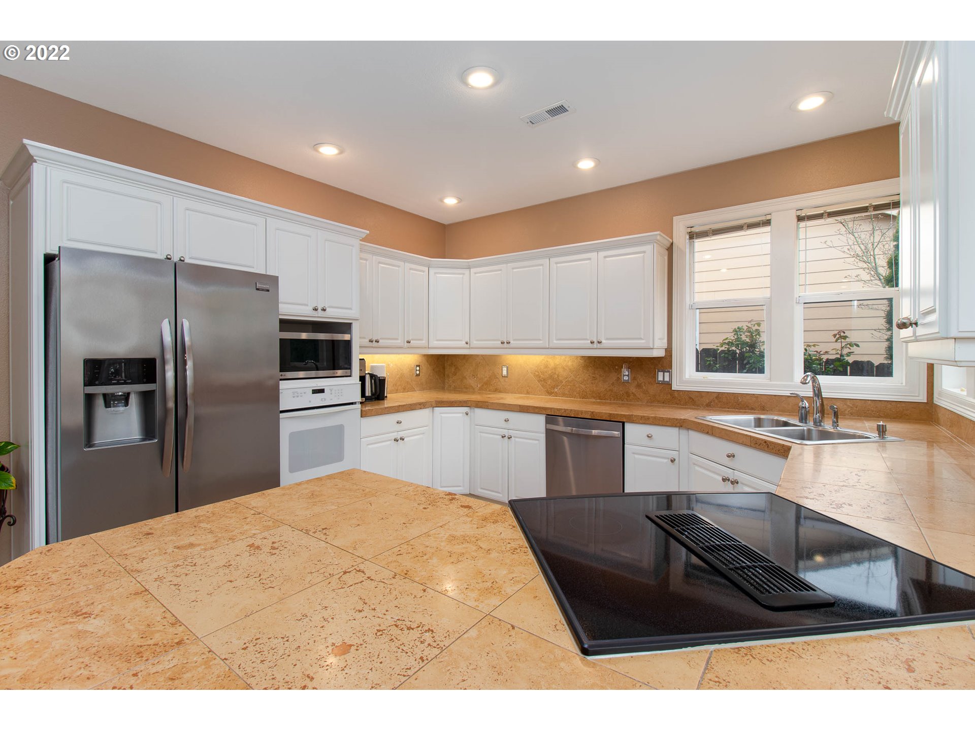 2131 Southeast 12th Avenue Camas, WA 98607 - Photo 12 of 32 a kitchen with granite countertop a refrigerator sink and cabinets