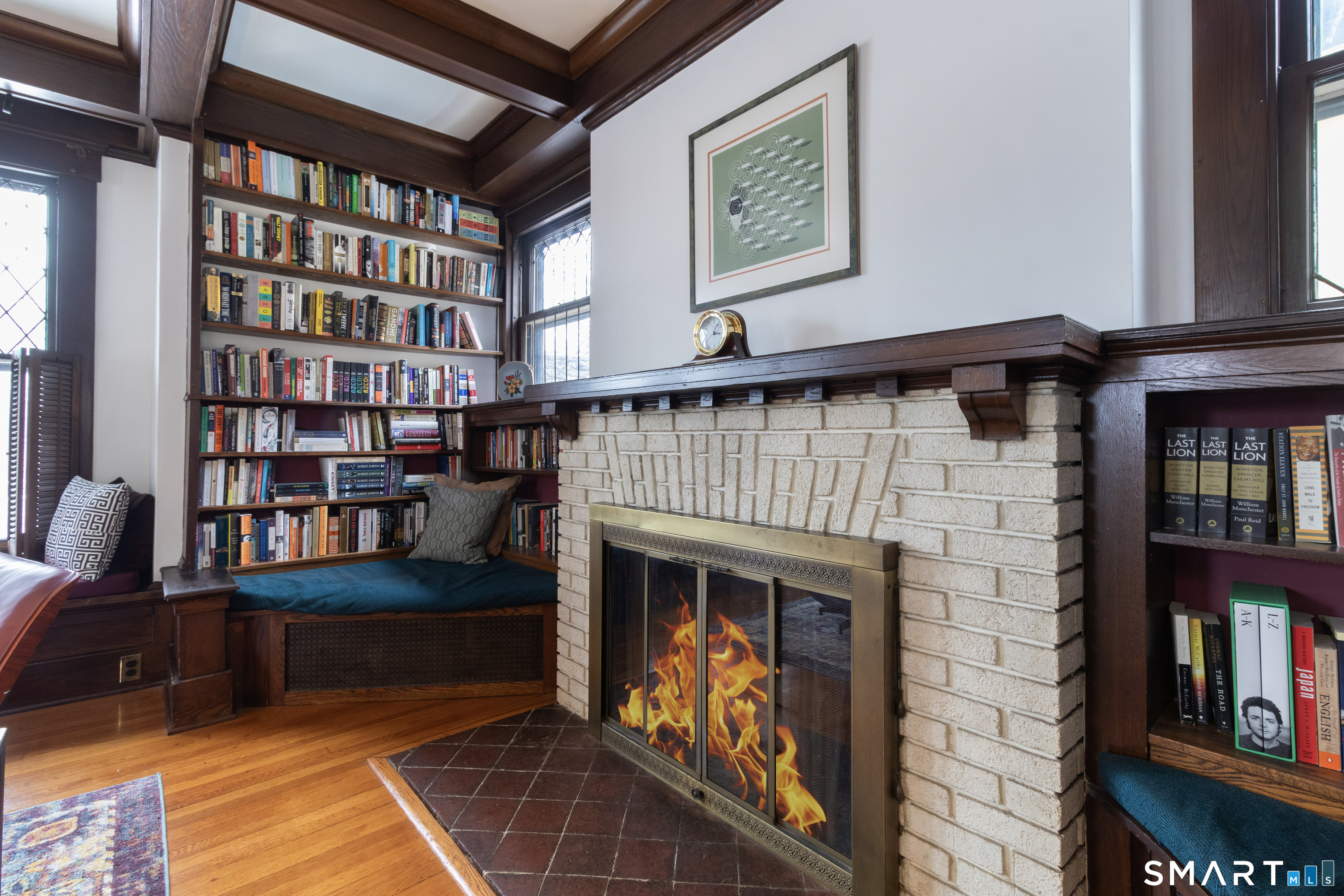 319 South Main Street Wallingford, CT 06492 - Photo 11 of 37 a living room with furniture and a book shelf
