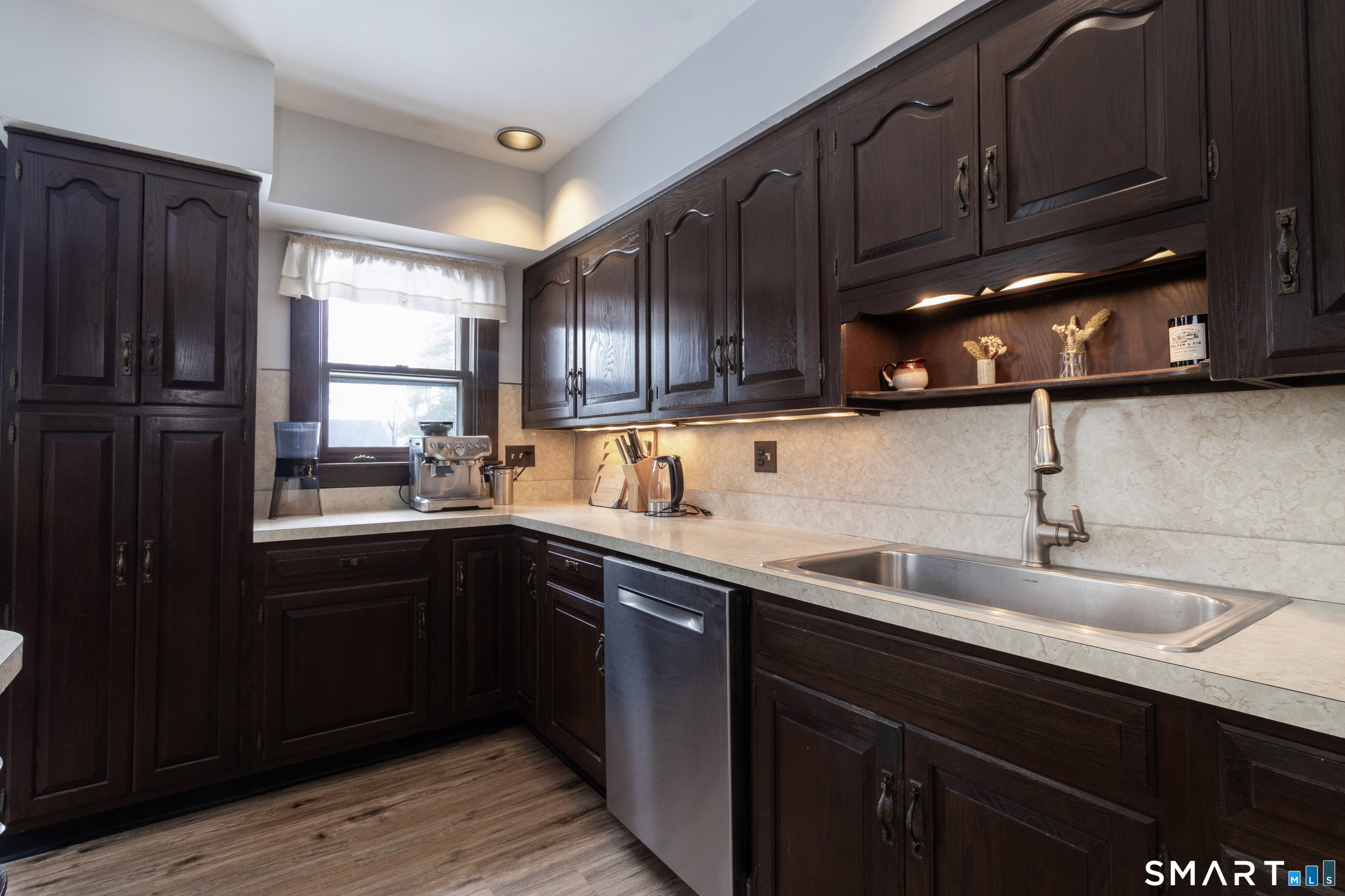 319 South Main Street Wallingford, CT 06492 - Photo 16 of 37 a kitchen with a sink cabinets and window