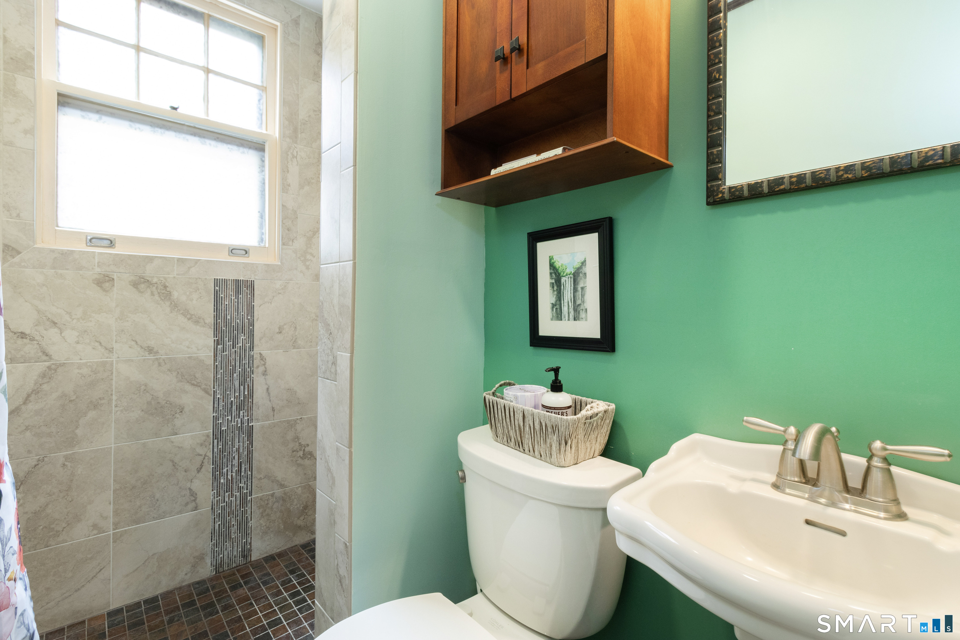 319 South Main Street Wallingford, CT 06492 - Photo 20 of 37 a bathroom with a toilet sink and mirror