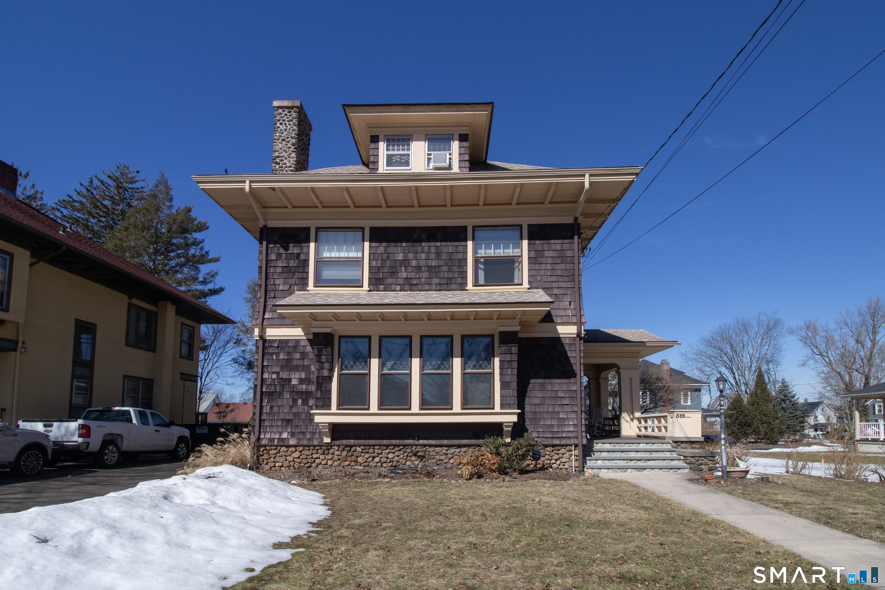 319 South Main Street Wallingford, CT 06492 - Photo 2 of 37 a front view of a house with a yard