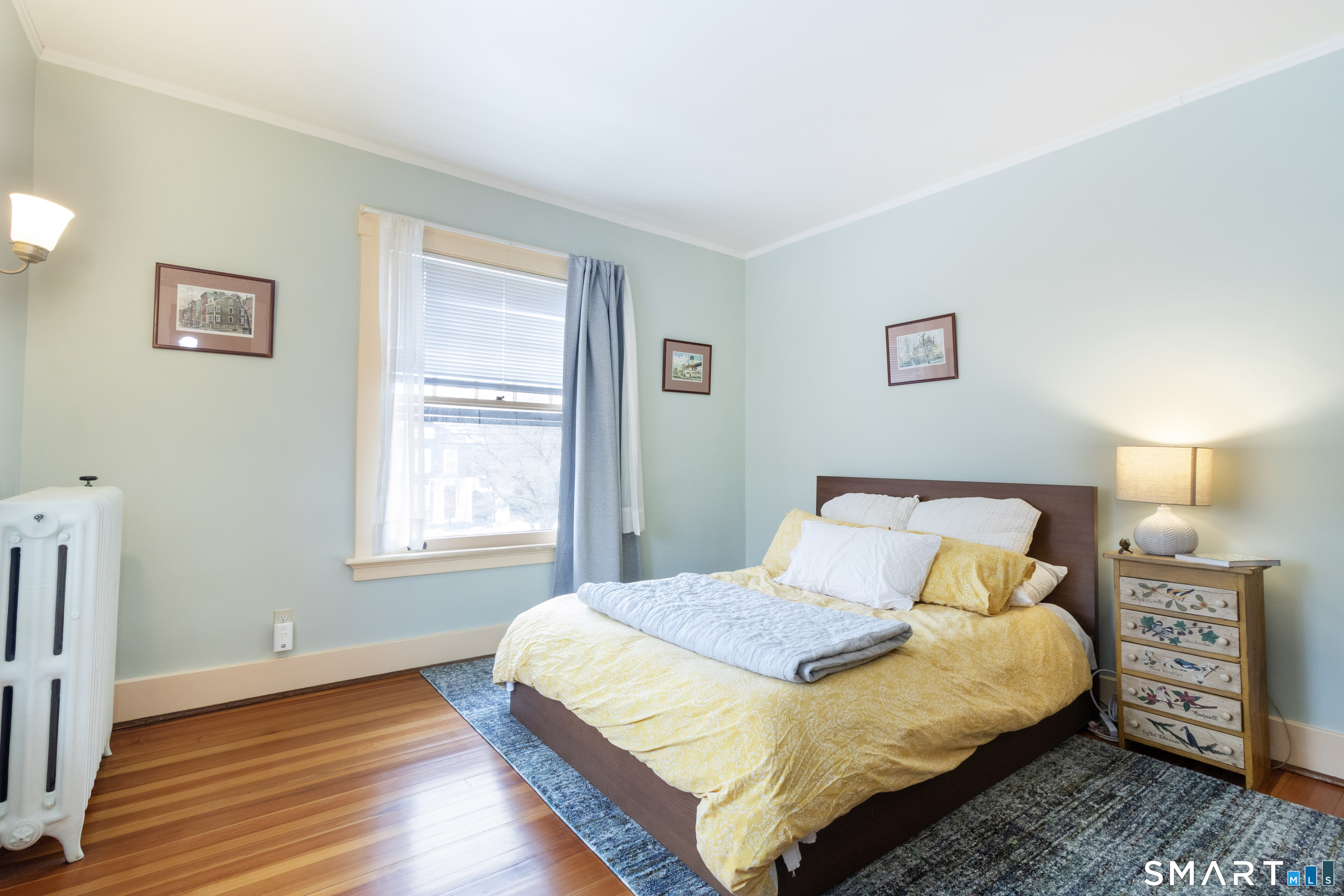 319 South Main Street Wallingford, CT 06492 - Photo 25 of 37 a bedroom with a bed and a night stand