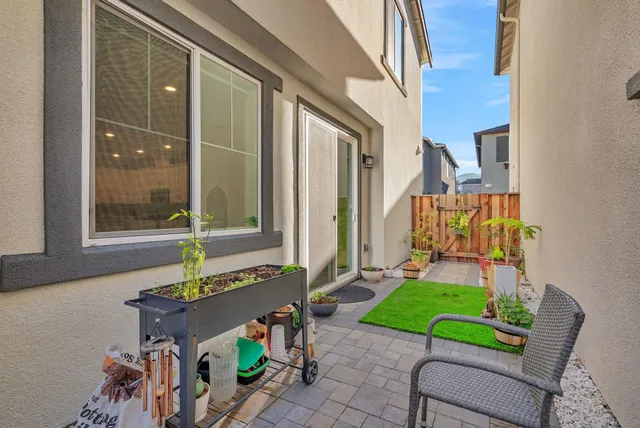 a view of two chairs in the patio