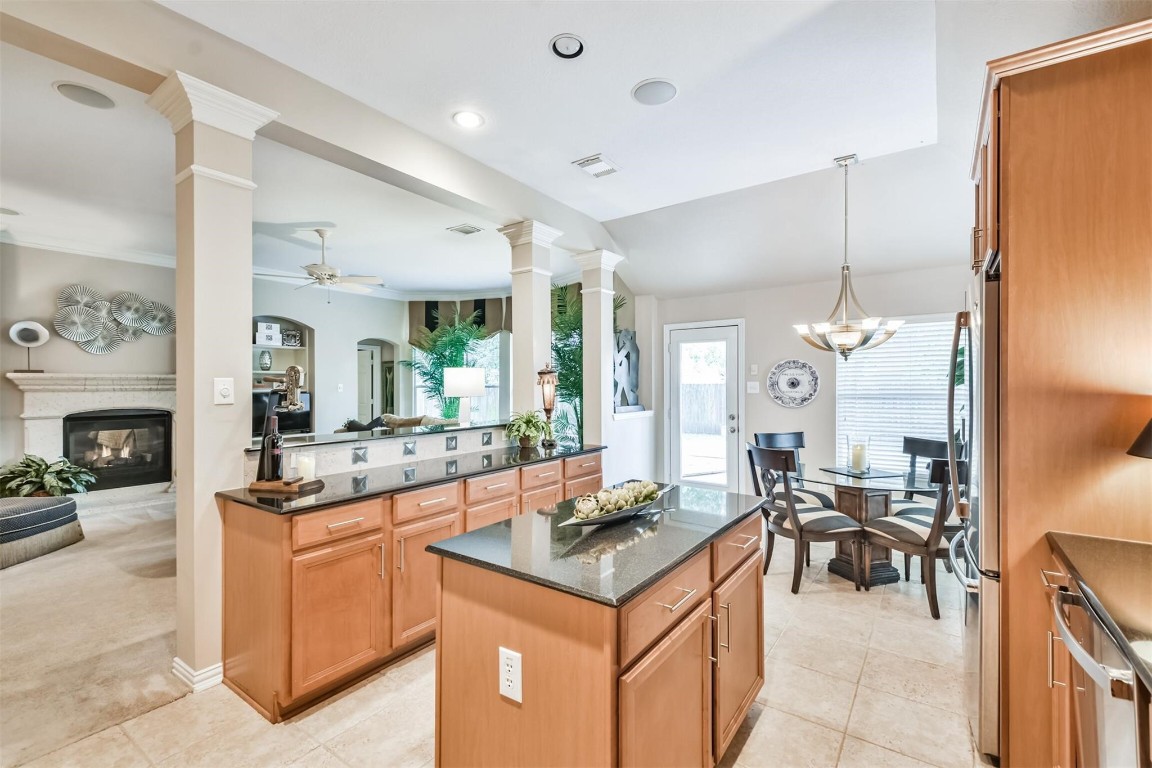 12711 Big Spring Trail Humble, TX 77346 - Photo 12 of 25 a kitchen with a stove and cabinets