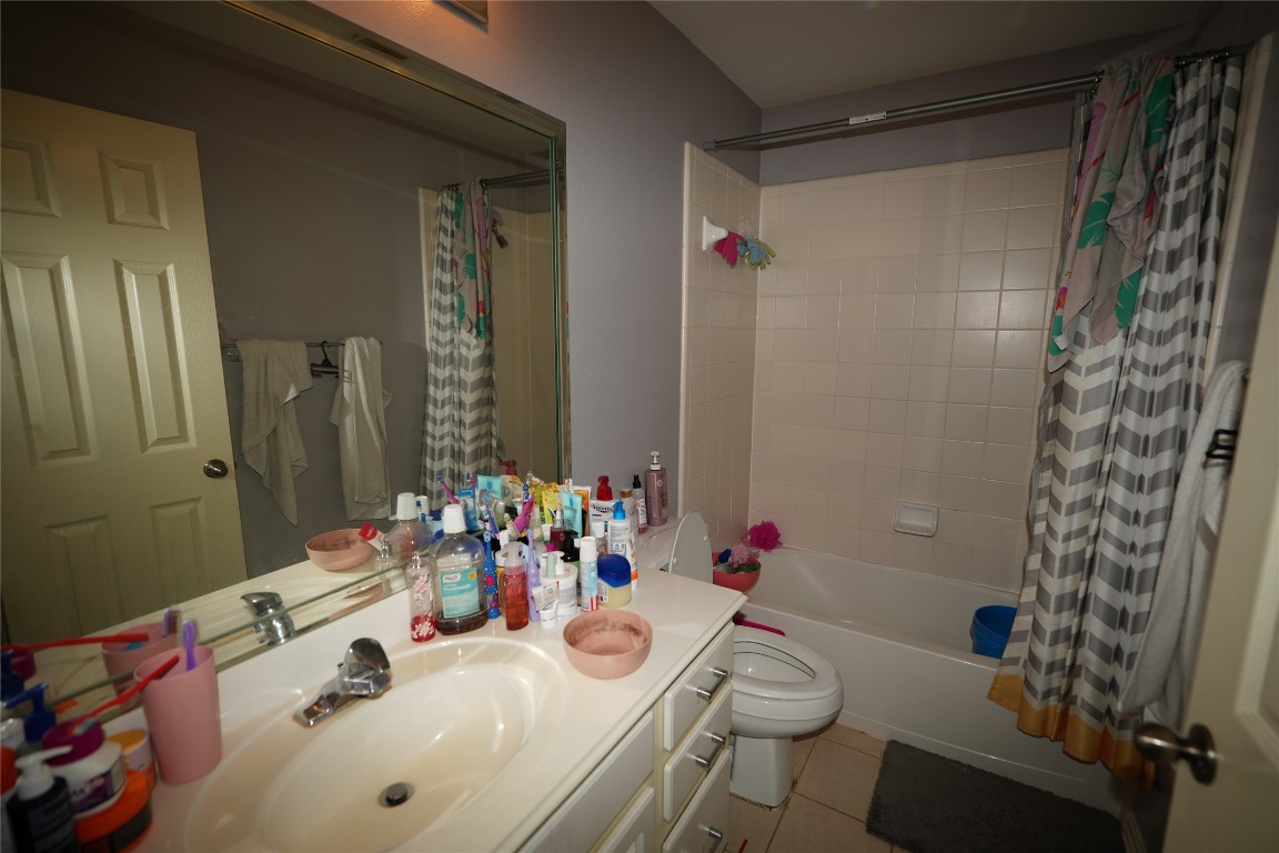 12711 Big Spring Trail Humble, TX 77346 - Photo 22 of 25 a bathroom with a sink toilet and shower