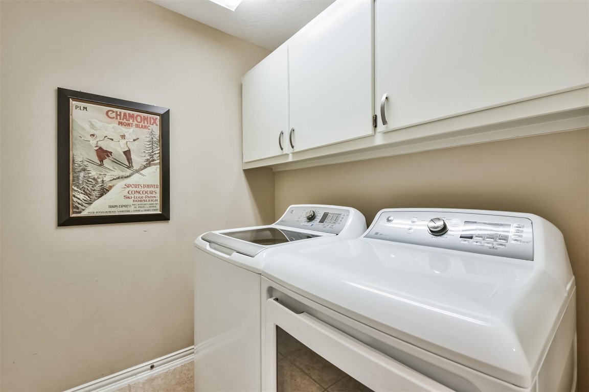 12711 Big Spring Trail Humble, TX 77346 - Photo 23 of 25 a utility room with dryer and washer