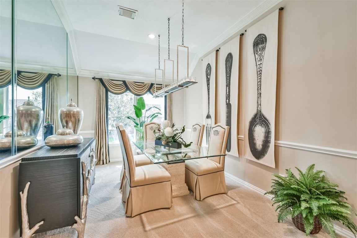 12711 Big Spring Trail Humble, TX 77346 - Photo 5 of 25 a dining room with furniture a chandelier and wooden floor