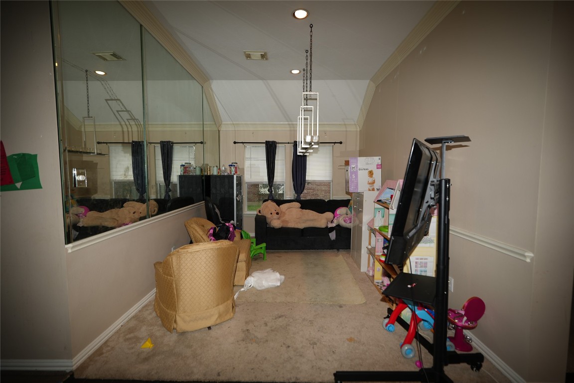 12711 Big Spring Trail Humble, TX 77346 - Photo 7 of 25 a living room with lots of furniture and a chandelier