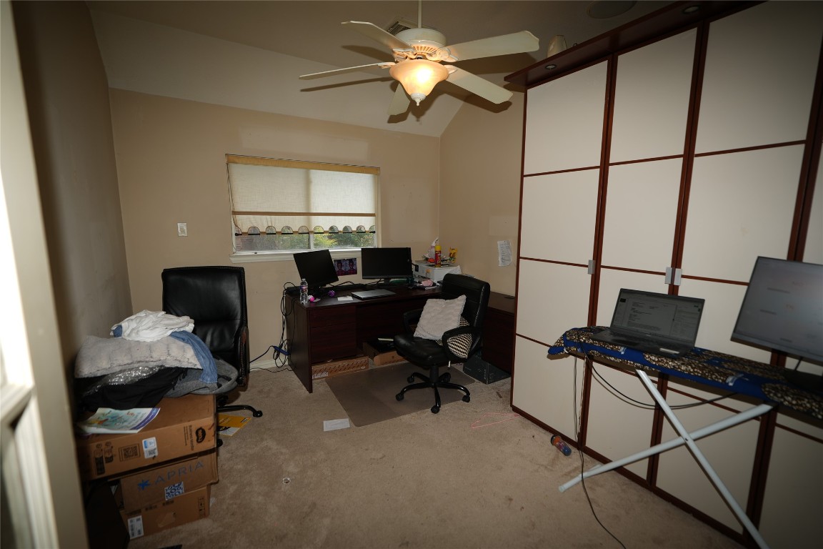 12711 Big Spring Trail Humble, TX 77346 - Photo 9 of 25 a view of a workspace with furniture and a window