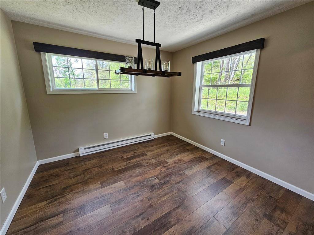 138 Center Drive Chicora, PA 16025 - Photo 14 of 25 a view of an empty room with wooden floor and a window