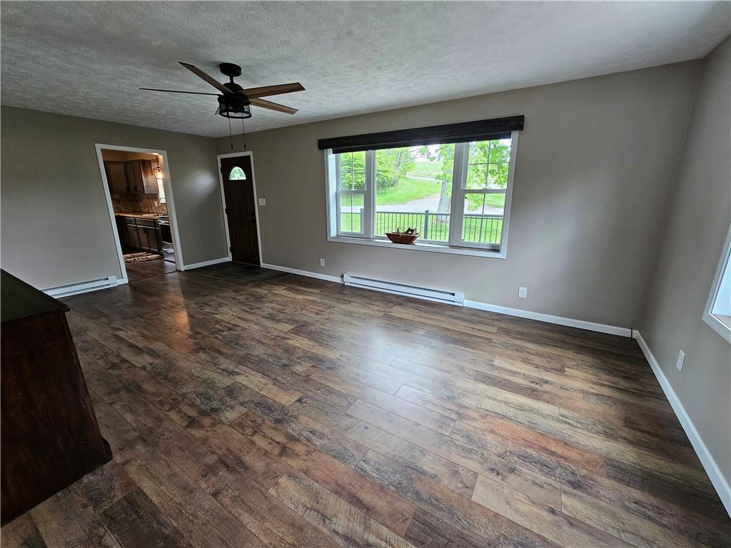 138 Center Drive Chicora, PA 16025 - Photo 17 of 25 wooden floor in an empty room with a window