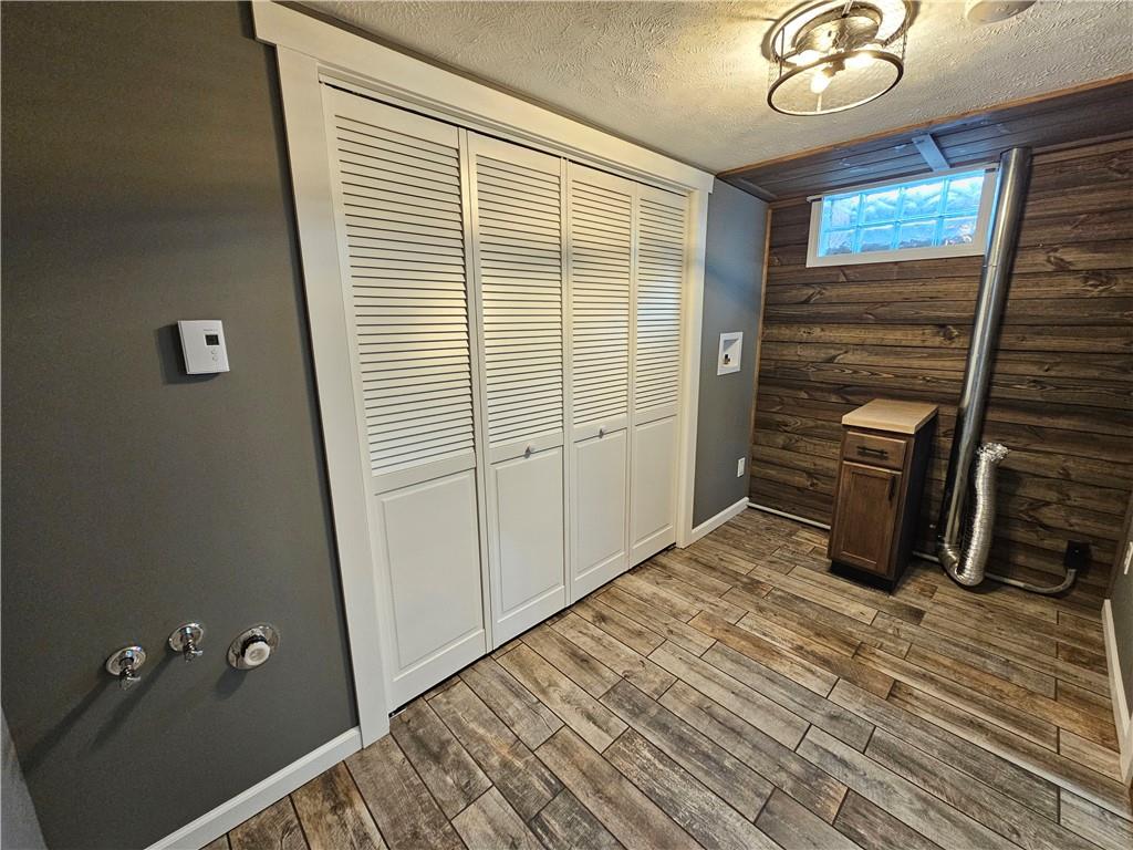 138 Center Drive Chicora, PA 16025 - Photo 20 of 25 a view of an empty room with wooden floor and a window