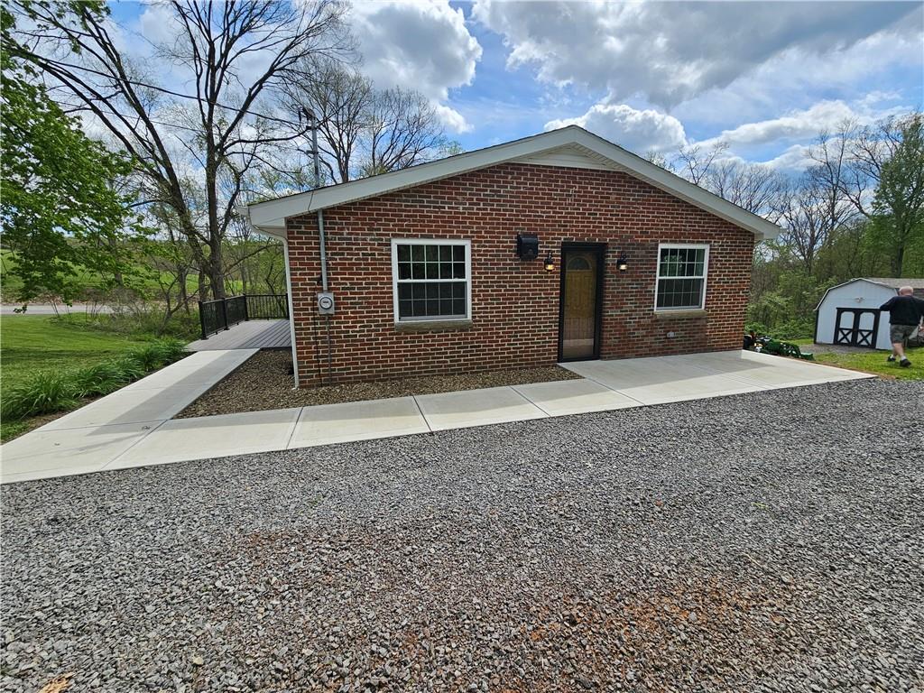 138 Center Drive Chicora, PA 16025 - Photo 2 of 25 a front view of a house with garden