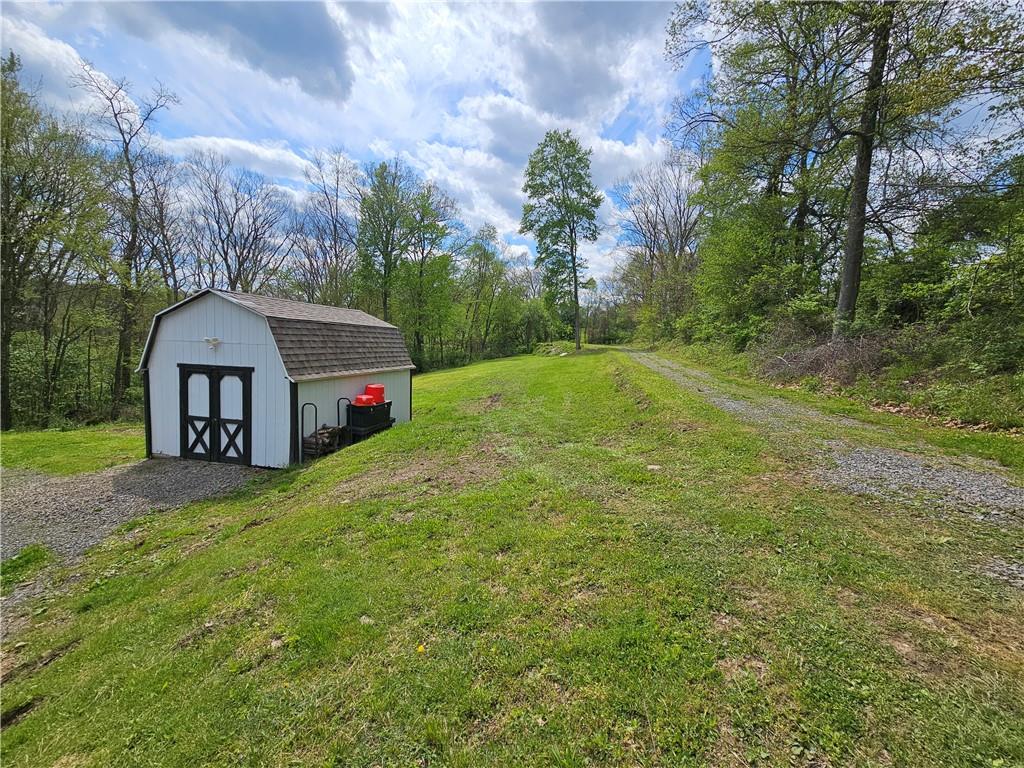 138 Center Drive Chicora, PA 16025 - Photo 5 of 25 a view of a house with a yard and sitting area