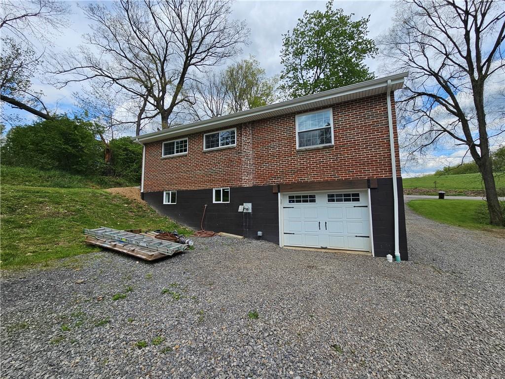 138 Center Drive Chicora, PA 16025 - Photo 8 of 25 a front view of a house with a yard