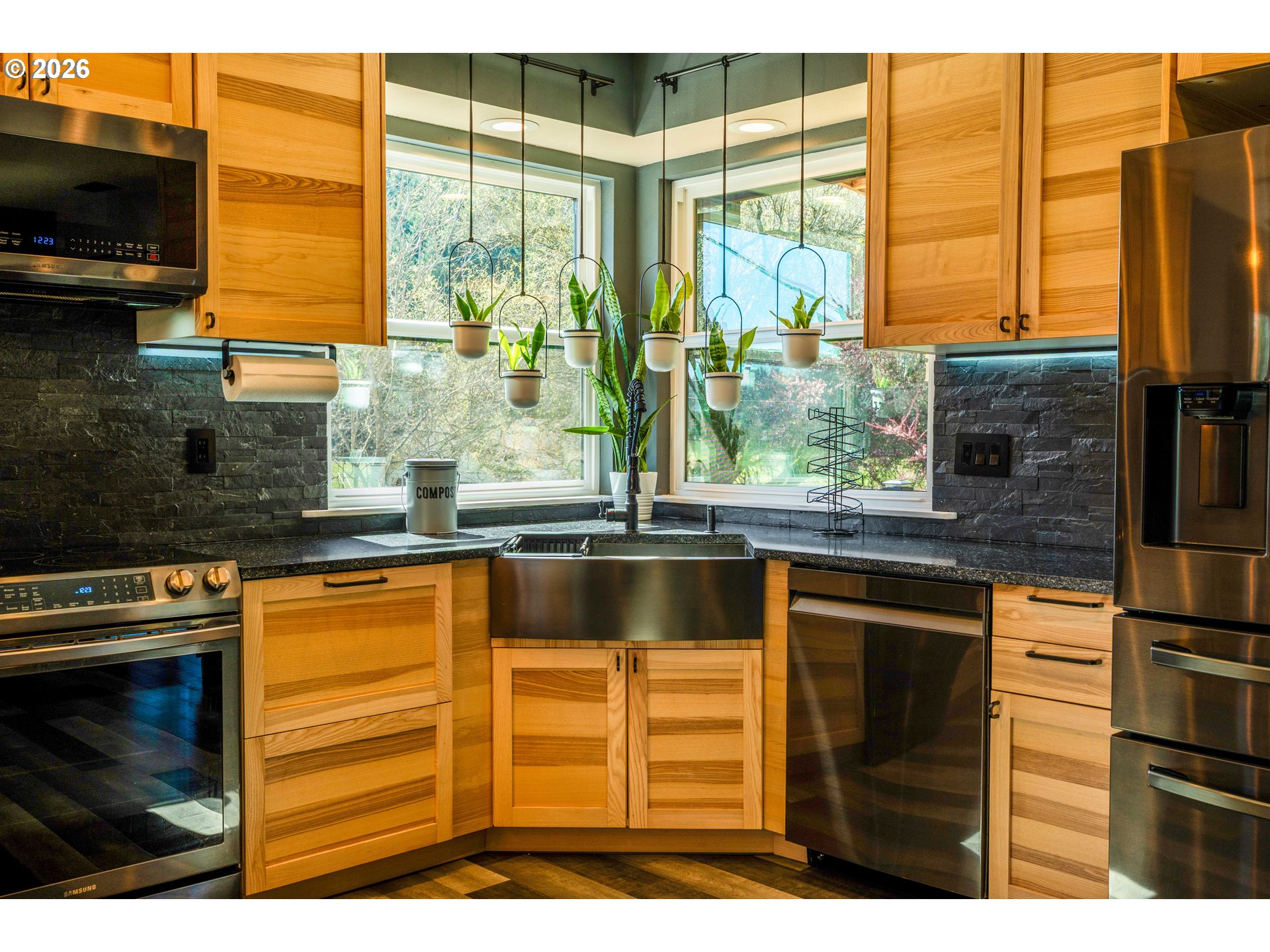 16515 Highway 47 Banks, OR 97106 - Photo 12 of 48 a kitchen with stainless steel appliances granite countertop a stove and a microwave