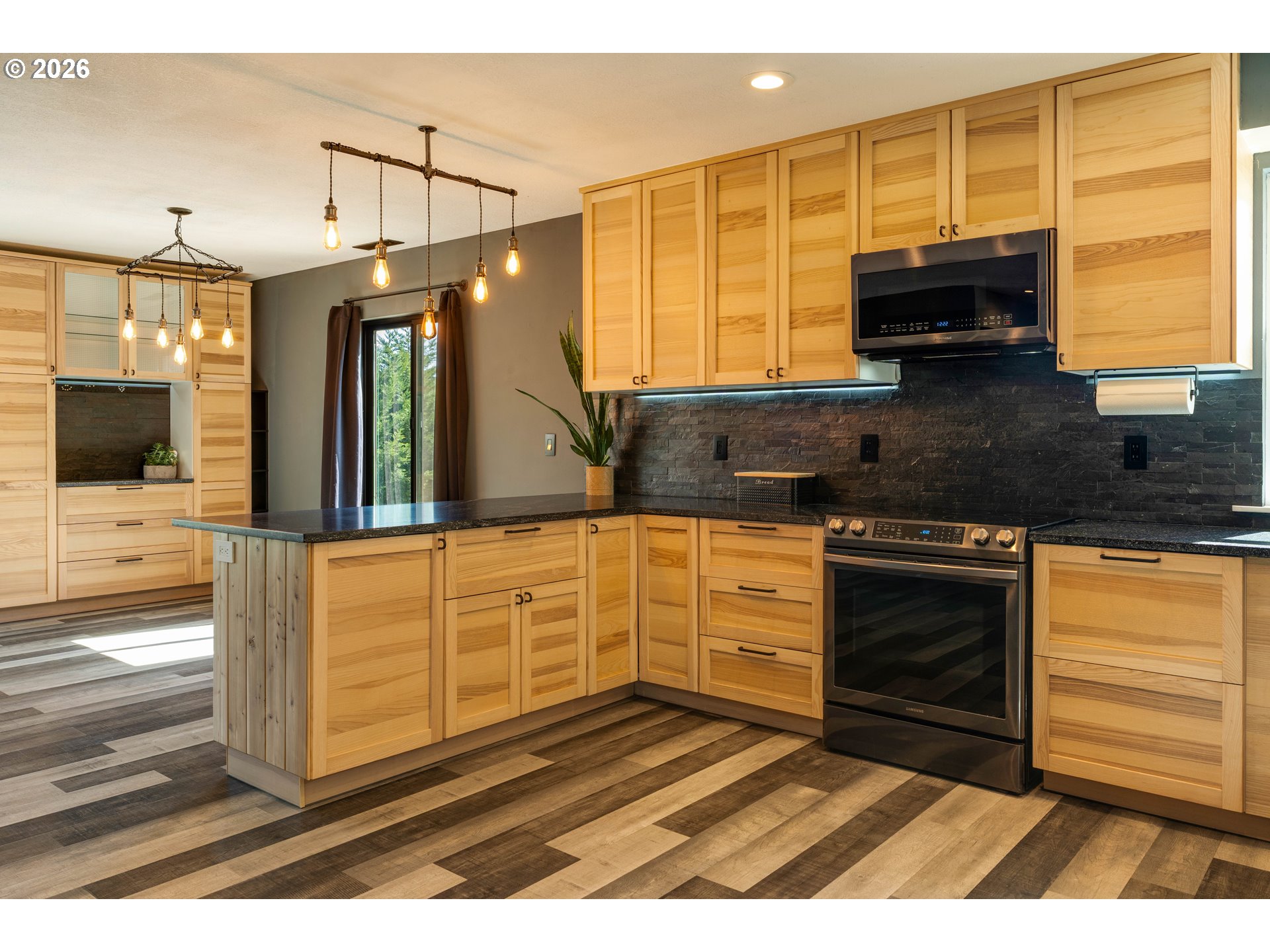 16515 Highway 47 Banks, OR 97106 - Photo 13 of 48 a kitchen with granite countertop a sink and a stove top oven