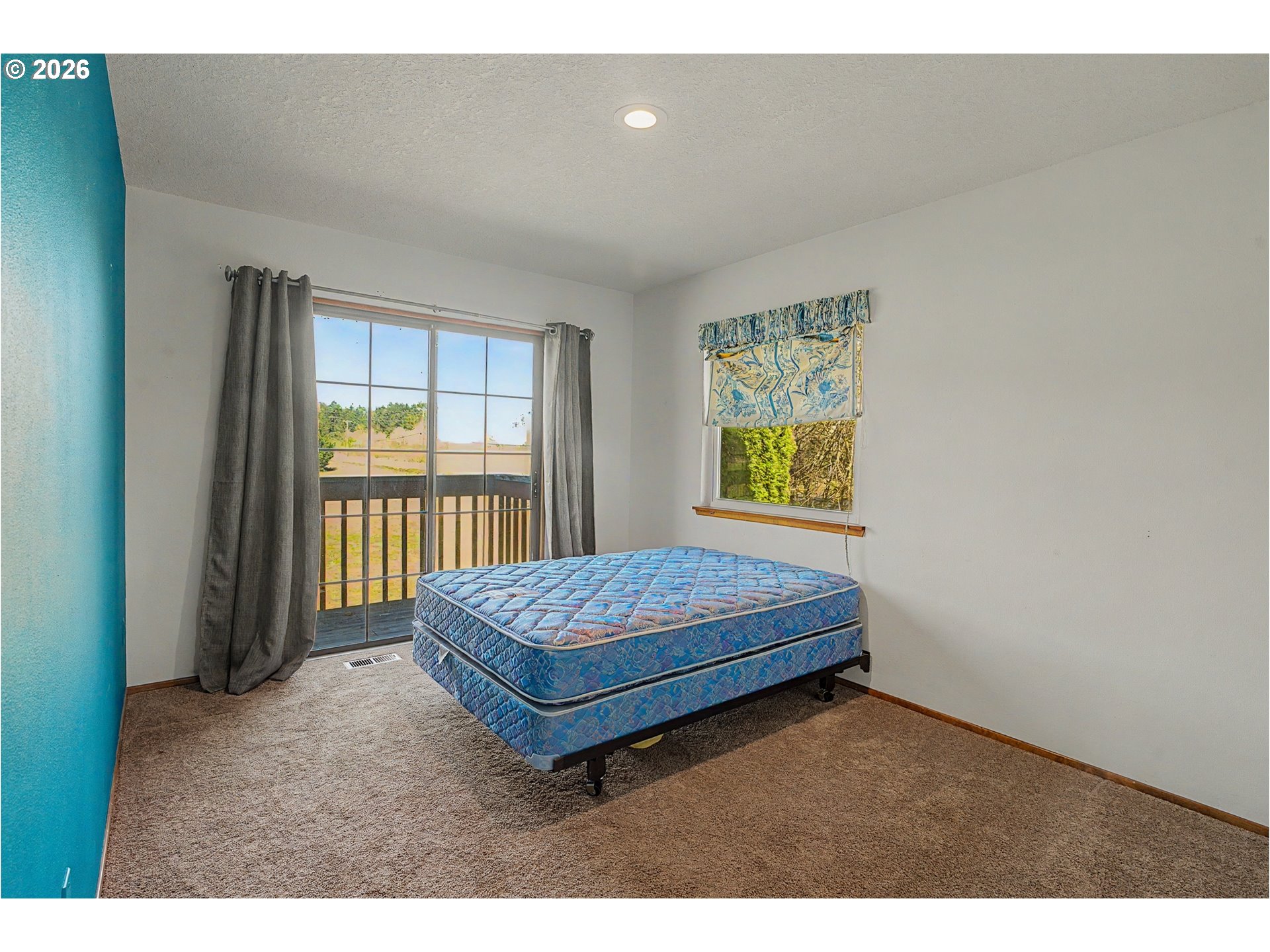 16515 Highway 47 Banks, OR 97106 - Photo 19 of 48 a room with a bed and a window