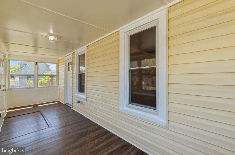 5907 Queen Anne Street Baltimore, MD 21207 - Photo 6 of 39 FRONT SUNROOM