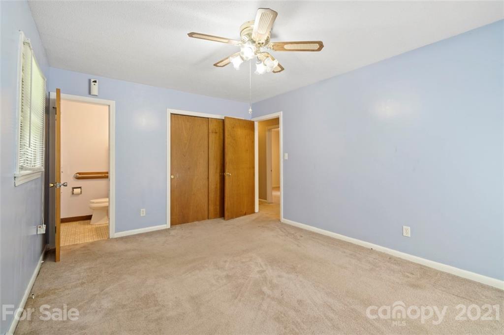 1912 Normandy Road Kannapolis, NC 28081 - Photo 13 of 43 a view of an empty room with a ceiling fan