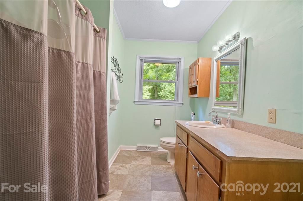1912 Normandy Road Kannapolis, NC 28081 - Photo 20 of 43 a bathroom with a sink and a mirror