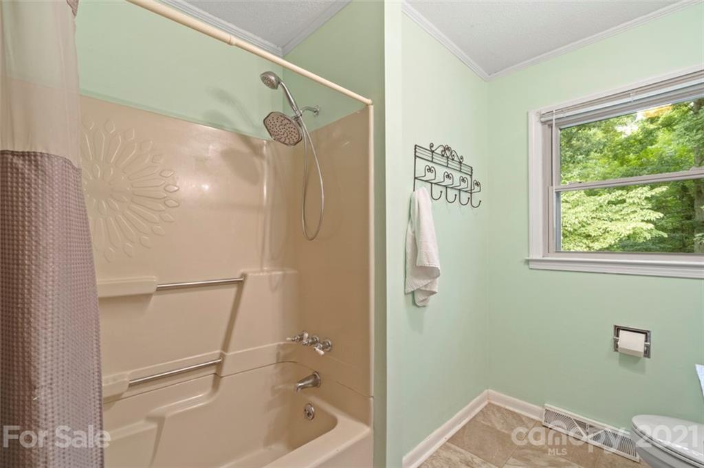 1912 Normandy Road Kannapolis, NC 28081 - Photo 21 of 43 a bathroom with a shower and a window