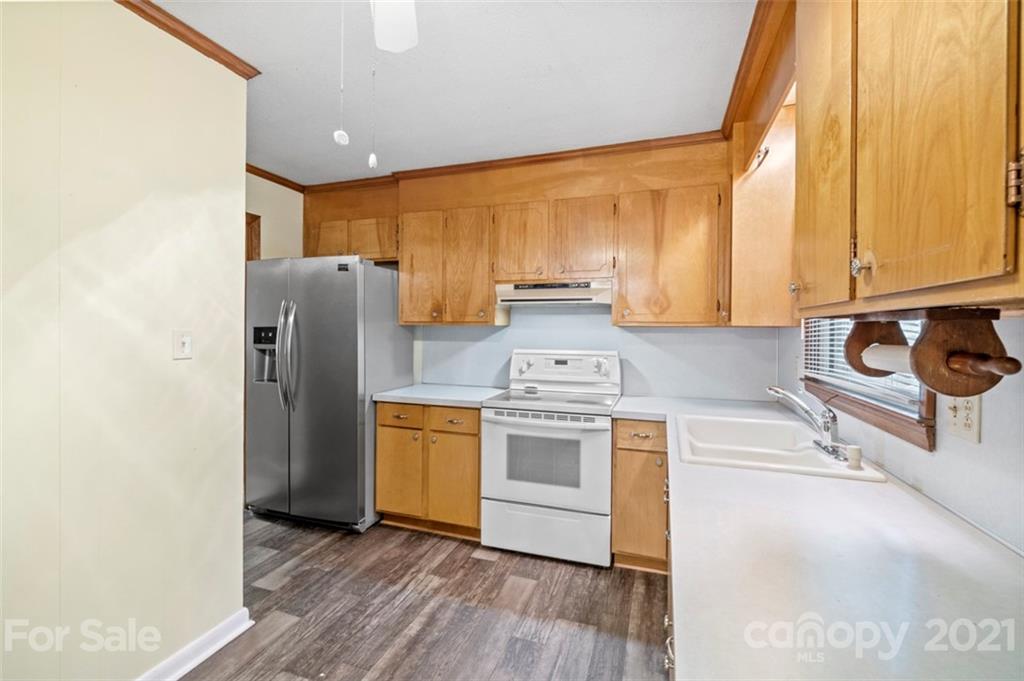 1912 Normandy Road Kannapolis, NC 28081 - Photo 10 of 43 a kitchen with stainless steel appliances a stove a sink and a refrigerator