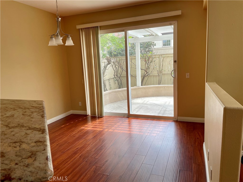 149 Islington Irvine, CA 92620 - Photo 6 of 15 a view of a livingroom with wooden floor and a large window