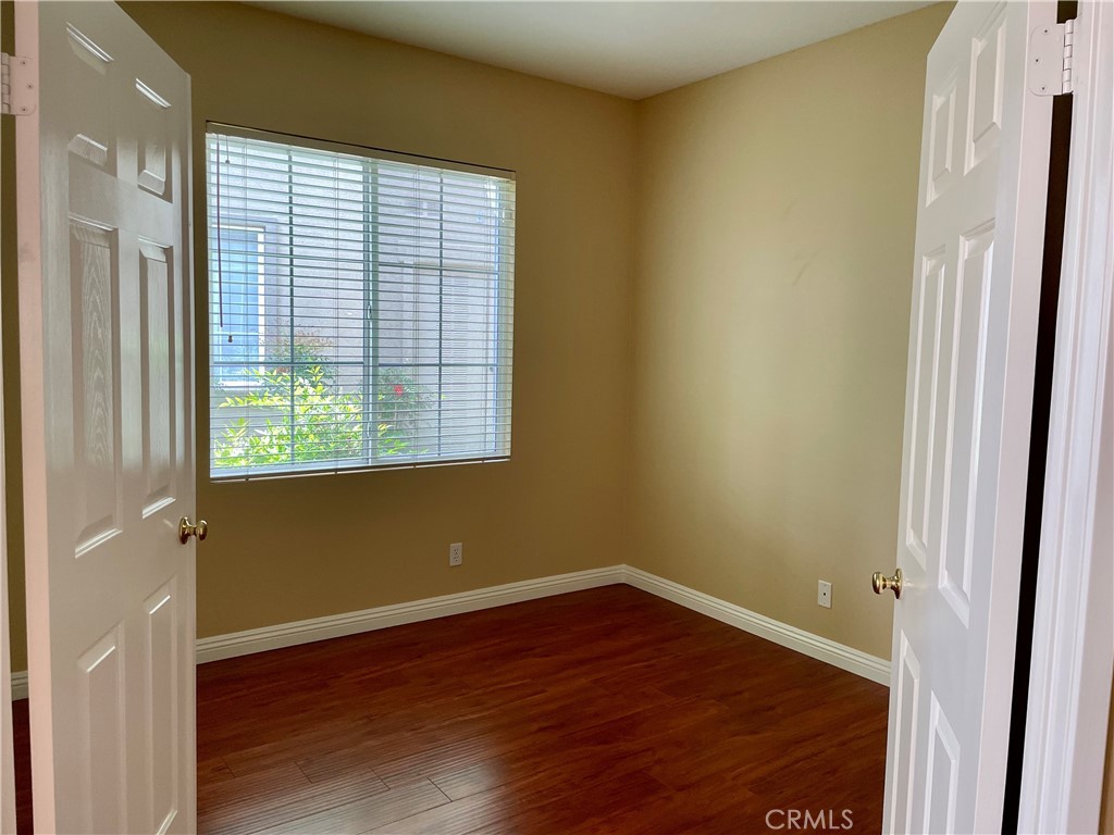 149 Islington Irvine, CA 92620 - Photo 9 of 15 a view of a room with wooden floor and a window