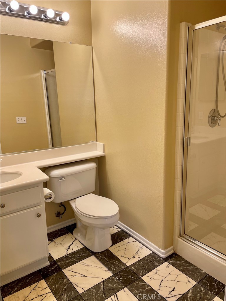 149 Islington Irvine, CA 92620 - Photo 10 of 15 a bathroom with a toilet and a shower
