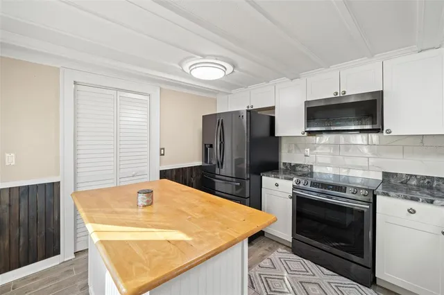 a kitchen with a stove and a microwave