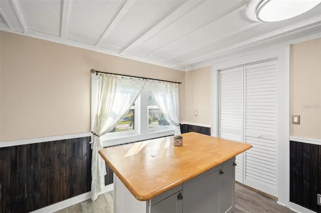 a kitchen with sink a stove and microwave