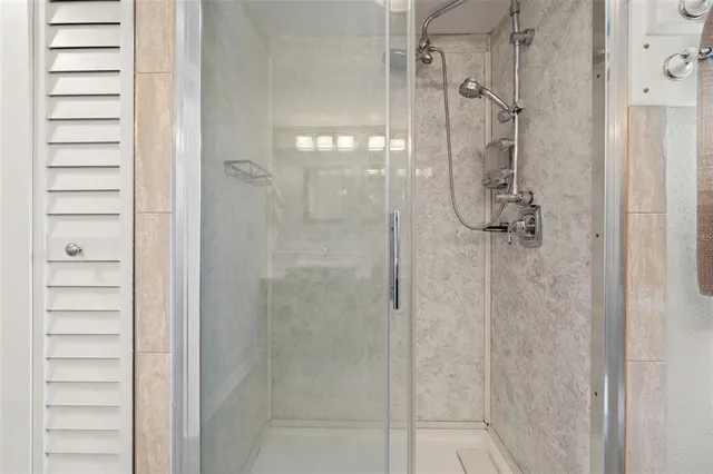 a kitchen with stainless steel appliances granite countertop a stove a sink a dining table and chairs