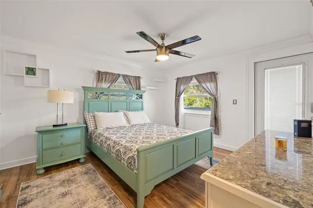 a kitchen with stainless steel appliances granite countertop a stove a sink a microwave and a refrigerator