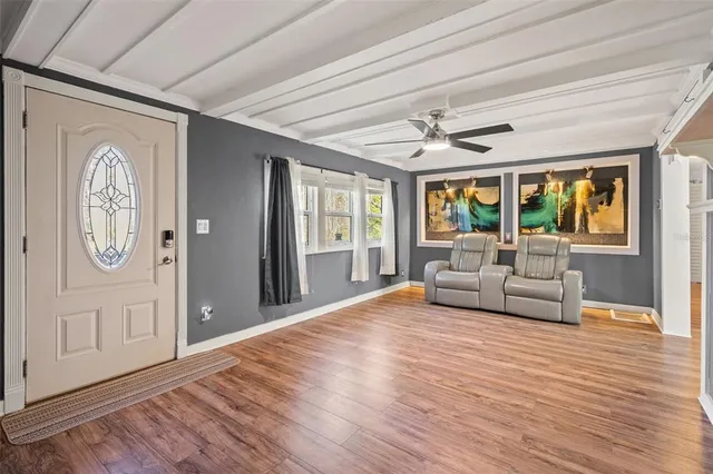a view of a house with a wooden door and a window