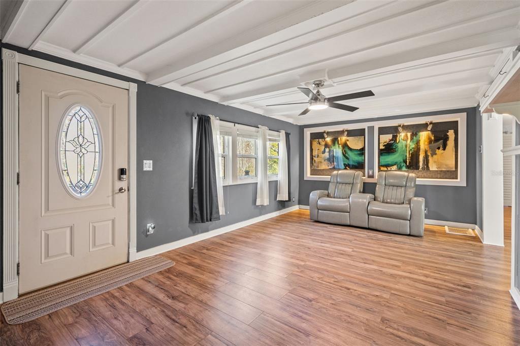 7288 Coventry Court Weeki Wachee, FL 34607 - Photo 28 of 82 a living room with furniture and a large window