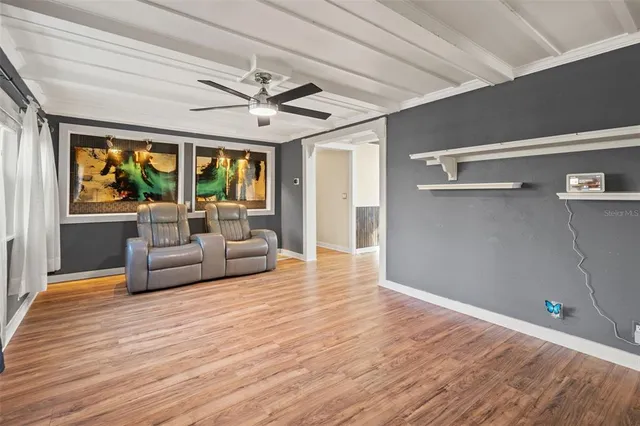 a view of balcony with wooden floor and fence