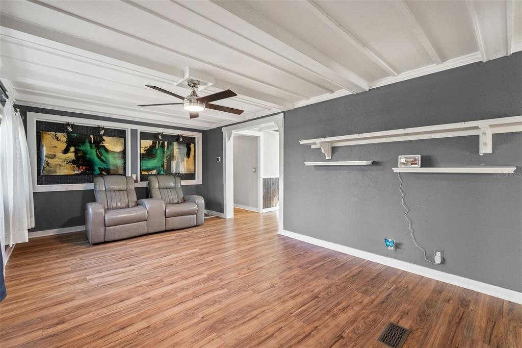7288 Coventry Court Weeki Wachee, FL 34607 - Photo 3 of 82 a living room with furniture and a large window