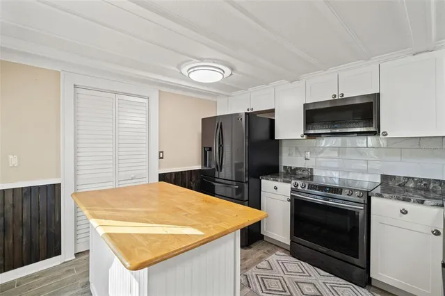 a view of a balcony with wooden floor