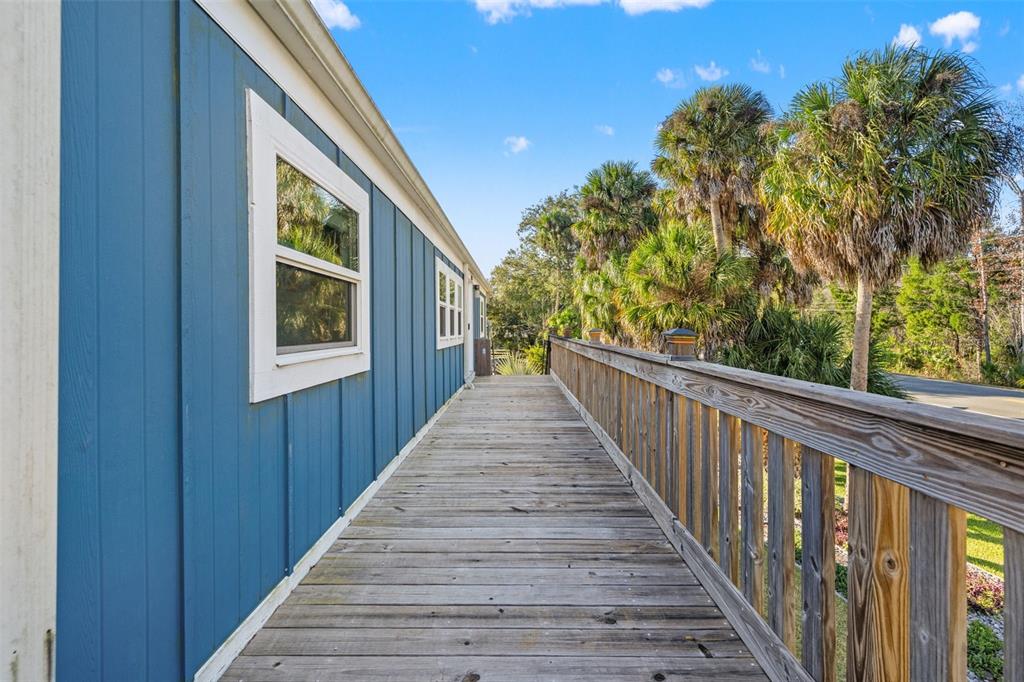 7288 Coventry Court Weeki Wachee, FL 34607 - Photo 49 of 82 a view of balcony with wooden floor and fence