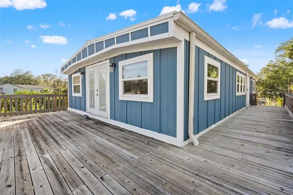 a aerial view of a house with swimming pool and a yard