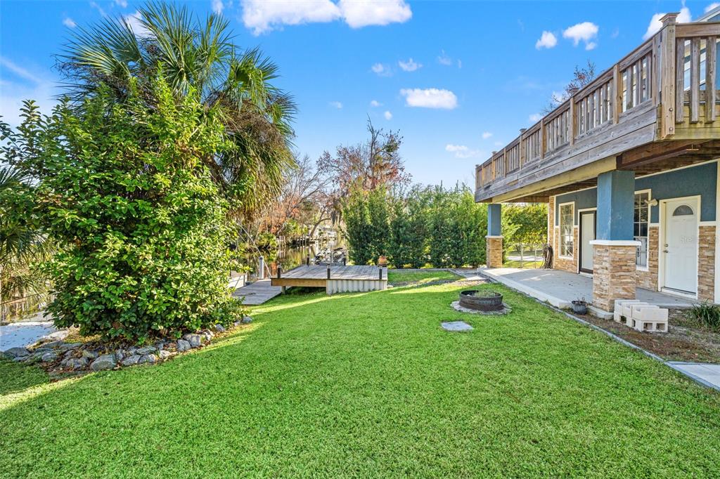 7288 Coventry Court Weeki Wachee, FL 34607 - Photo 58 of 82 a view of a house with a backyard