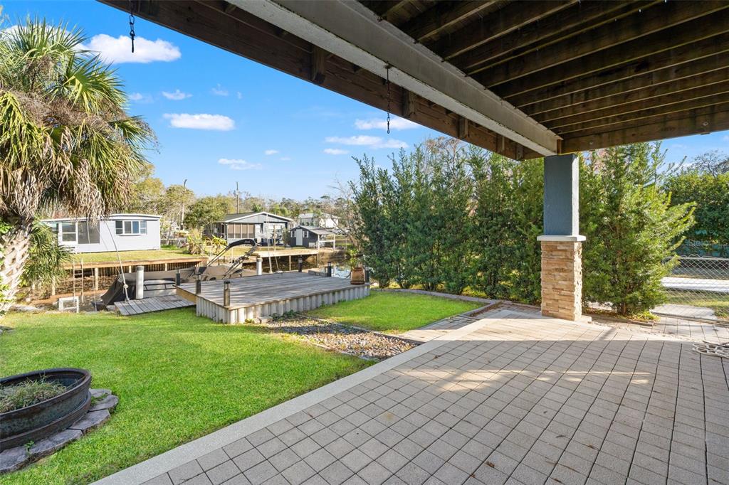 7288 Coventry Court Weeki Wachee, FL 34607 - Photo 66 of 82 a view of a porch with a yard