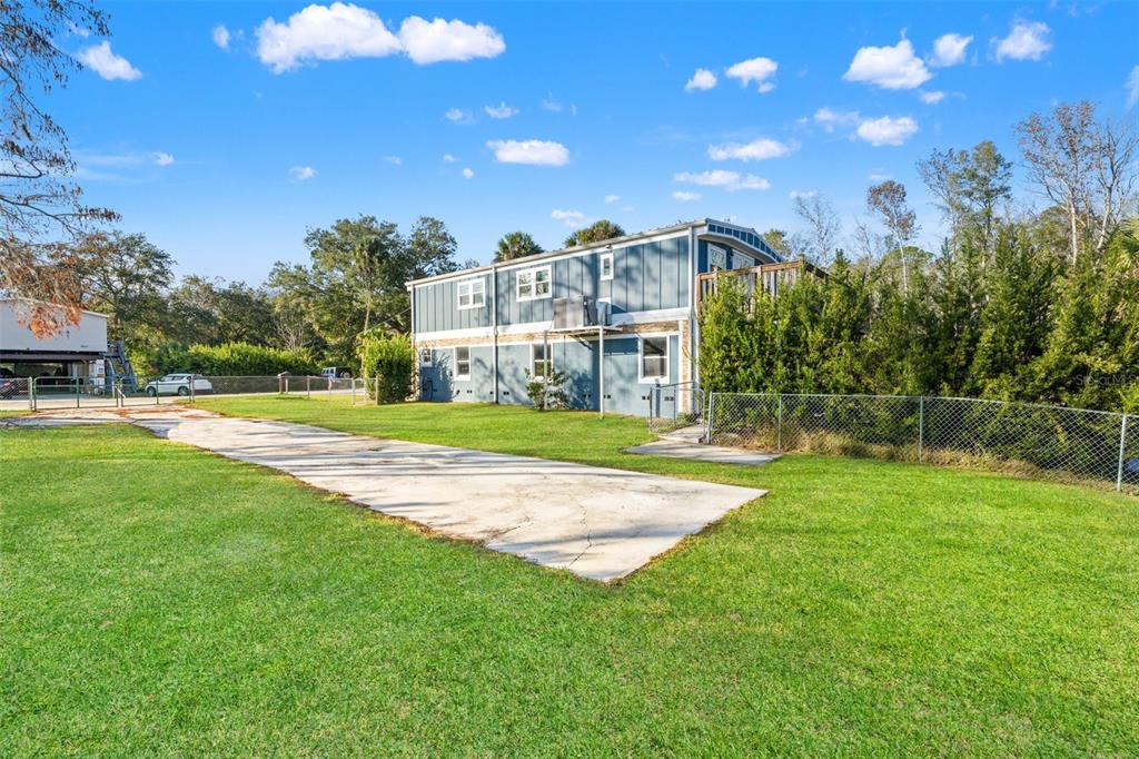 7288 Coventry Court Weeki Wachee, FL 34607 - Photo 70 of 82 a view of a house with a big yard
