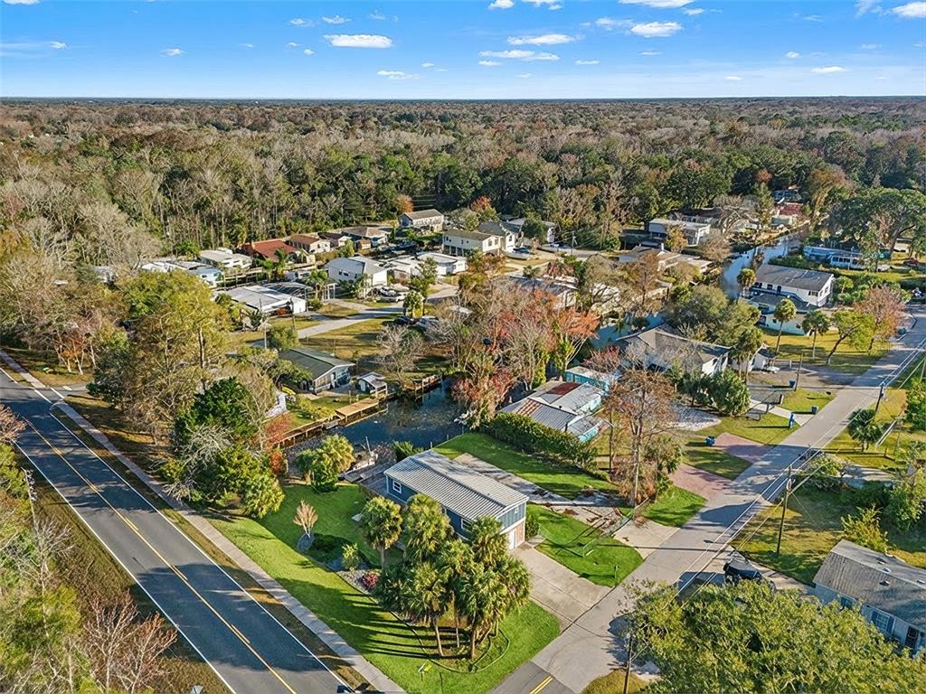 7288 Coventry Court Weeki Wachee, FL 34607 - Photo 76 of 82 an aerial view of residential houses with outdoor space
