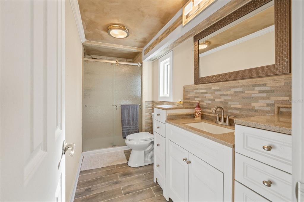 7288 Coventry Court Weeki Wachee, FL 34607 - Photo 8 of 82 a bathroom with a sink a toilet and vanity