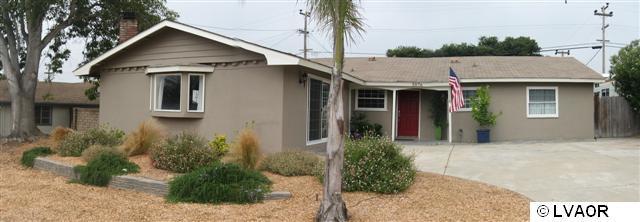3976 Constellation Road Lompoc, CA 93436 - Photo 1 of 9 a front view of a house with garden