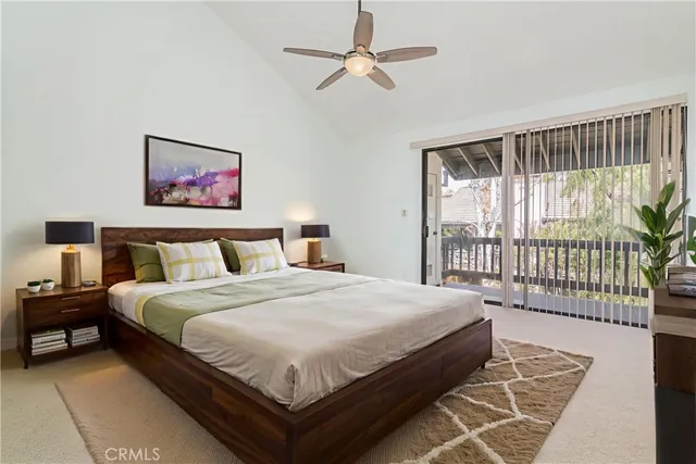 a large bedroom with a bed and a window