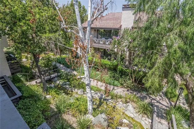 an aerial view of house with yard