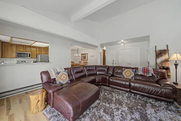 a kitchen with stainless steel appliances granite countertop a refrigerator sink and cabinets